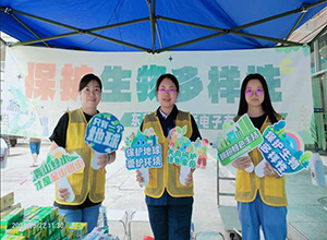 Posing with photo props themed around biodiversity and environmental protection